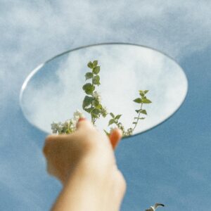 A Person Holding a Mirror